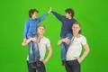 The four smile brothers stand on the green background Photo