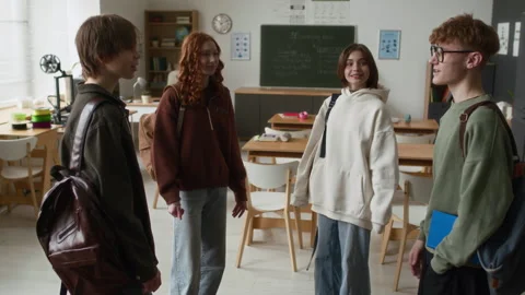 Four Smiling Students Chatting in Modern Classroom with 3D Printers Stock Footage 335692070