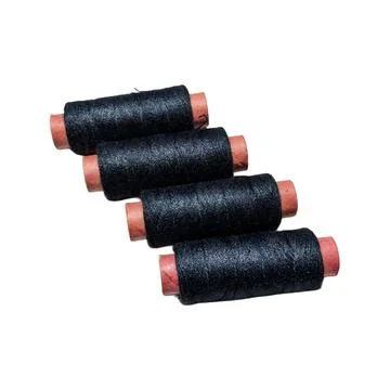 Four Spools of Black Sewing Thread on Brown Paper Tubes Stock Photos