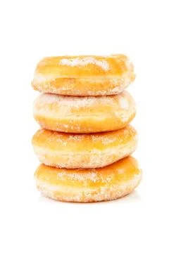 Four stacked sugared delicious donuts Stock Photos
