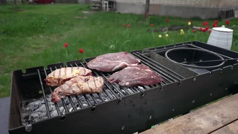 Four steaks on the grill. Stock Footage 277108115