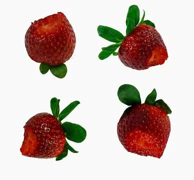 Four strawberries with bite marks on a white background show freshness and .. Stock Photos
