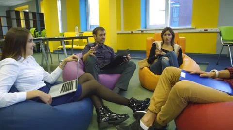 Four students sit in the modern class Stock Footage 67967745