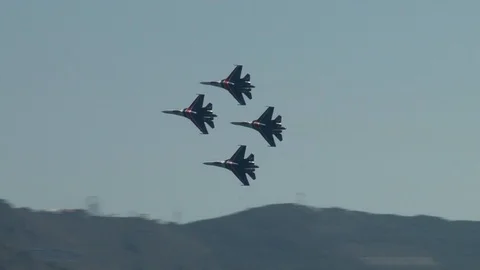 Four Su-27 multi-purpose aircraft perform group aerobatics above Gelendzhik Bay Stock Footage 121532403