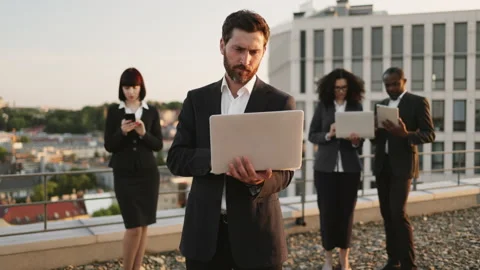 Four successful agents using portable devices for work Stock Footage 246116405