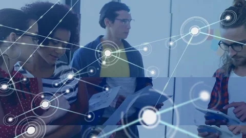 Four tech colleagues examining sheets tapping device starting glowing node Video stock 327958444