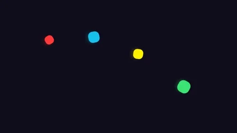 Four vibrant colorful dots scattered across a plain black background field Stock Footage 338311367