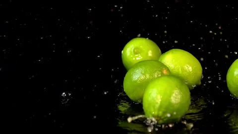 Four videos of falling lime in real slow motion Stock Footage 80673169