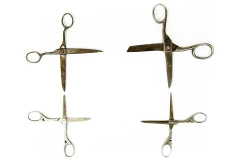 Four vintage scissors in quadrangular shape on white background 스톡 사진