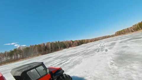 A four-wheel-drive SUV traverses the fragile spring ice. 4WD Vehicle Expedition Stock Footage 262635652
