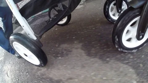 Four wheels baby stroller Stock Footage 72697597