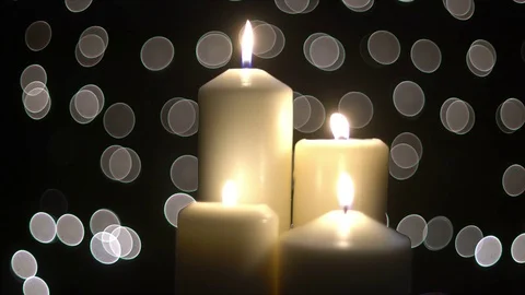 Four white candles light with bokeh Stock Footage 82683073