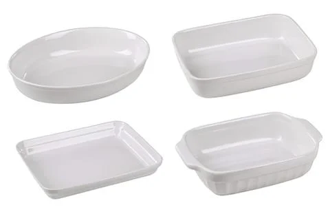 Four white ceramic baking dishes set Stock Photos