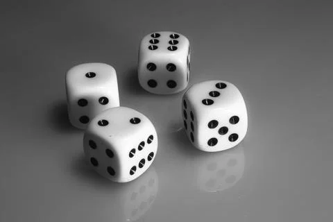 Four white dices Stock Photos