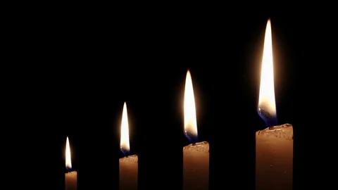 Four White Taper Candles Burning at Different Heights on Black background Stock-Footage 343425852