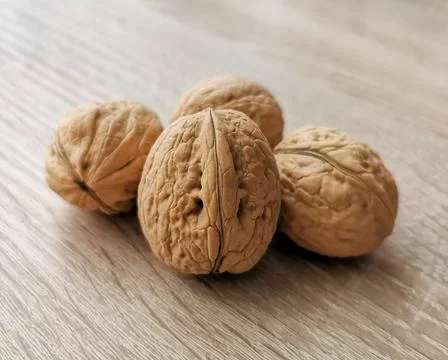Four whole walnuts Stock Photos