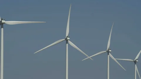 Four wind turbines in a descending row Stock Footage 111950945