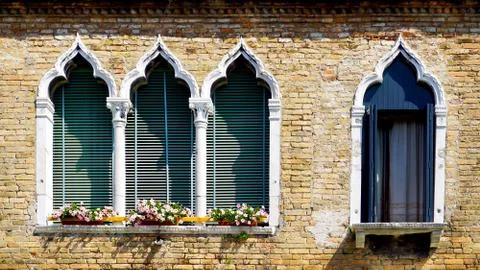 Four windows in arch shape and ancient decay brick wall Stock Photos