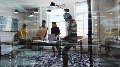 Four women working in business, binary overlay appearing and highlighting laptop Stock Footage 335651936