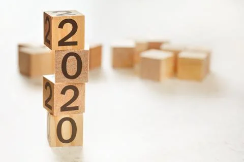 Four wooden cubes arranged in stack with text 2020 on them, space for text image 스톡 사진