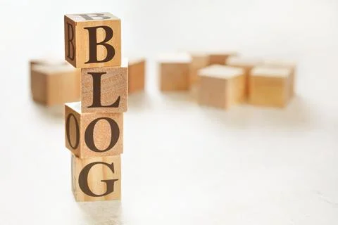 Four wooden cubes arranged in stack with word BLOG on them, space for text /  스톡 사진