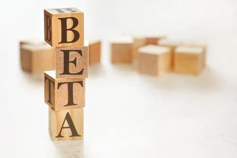 Four wooden cubes arranged in stack with word BETA on them, space for text... Stock Photos