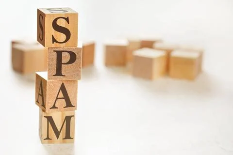Four wooden cubes arranged in stack with word SPAM on them, space for text... 스톡 사진