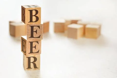 Four wooden cubes arranged in stack with word BEER (meaning Behaviour, eff... 스톡 사진
