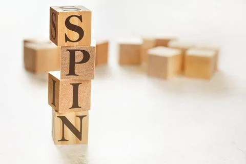 Four wooden cubes arranged in stack with word SPIN (meaning Solution Probl... 스톡 사진