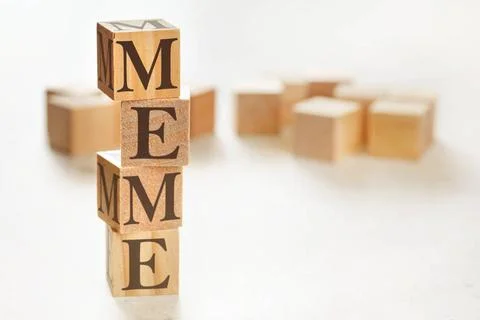 Four wooden cubes arranged in stack with word MEME on them, space for text... 스톡 사진