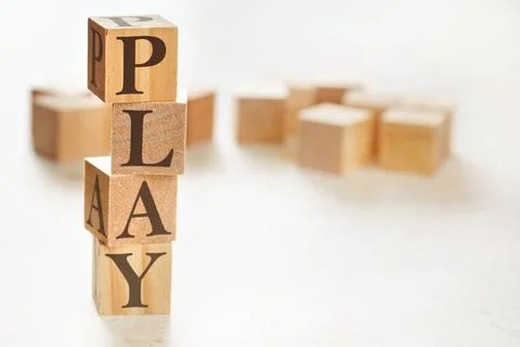 Four wooden cubes arranged in stack with word PLAY on them, space for text... 스톡 사진
