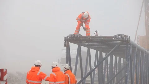 Four Workers, One of Them is Using a Hammer Stock Footage 72317087