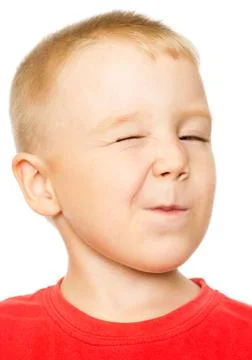 Four-Year-Old Boy making a Winking Face 写真素材