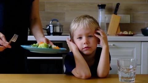 Four year old boy refusing to eat vegetables Stock Footage 96190443