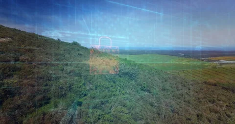 At fourth second drone panning over hill revealing data grid and forming padlock Stock Footage 312757969
