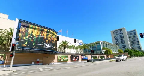 Fox movie studios with cinema entertainment billboards in Los Angeles, 4K Stock Footage 130999629