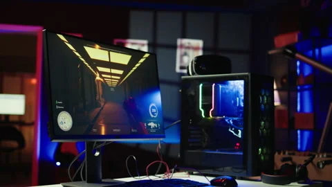 FPS videogame left open on pc display and computer peripherals in apartment Stock Footage 283033694