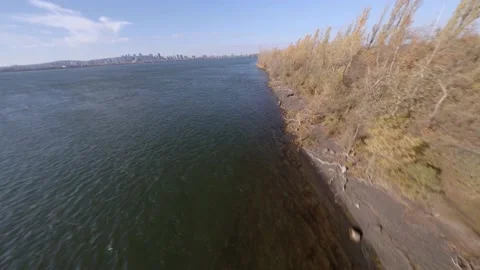 FPV Acrobatic Flying Manoeuvre  Alongside Petite Voie du Fleuve In Stock Footage 166031976