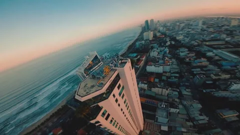 FPV aerial drone shot of Da Nang, sunset sea and hotels in Vietnam Stock Footage 242399697
