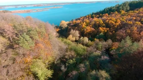FPV aerial drone view. Flying above autumn forest hills near Dnipro river Stock-Footage 144599676