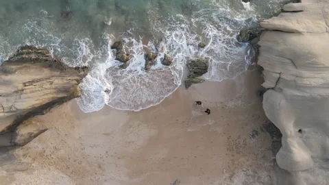 FPV Aerial Overhead View of Romantic Couple on Sandy Beach – 4K Drone Footage Stock Footage 319919760