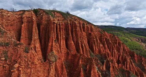 Fpv Aerial Pass By Large Red Clay Dune Natural Pyramid Ridges Reveal Forest Stock-Footage 300475688