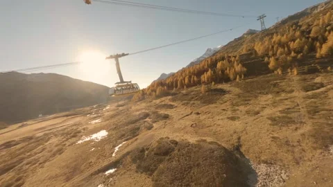 FPV aerial view of cable car in the Swiss Alps, Switzerland. Stock Footage 345071292