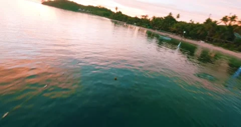 FPV aerial view of tropical beach at sunset in Fiji. Stock Footage 344971625