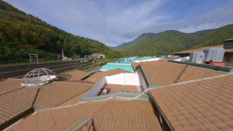 Fpv ascent from courtyard to mountain river Stock Footage 311077964