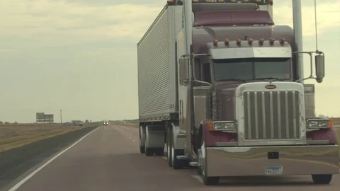FPV: Being overtaken by freight container semi truck on rural highway in USA Stock Footage 75060969