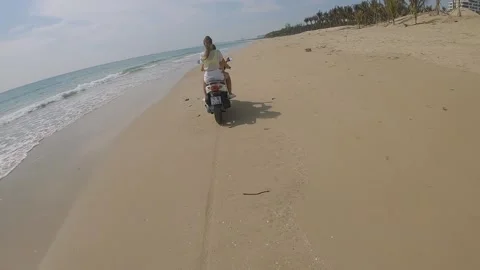 Fpv camera flies after two girls on a motorcycle Video stock 237731280