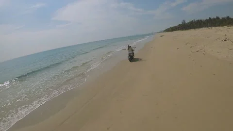 Fpv camera flies after two girls on a motorcycle Video stock 237731314