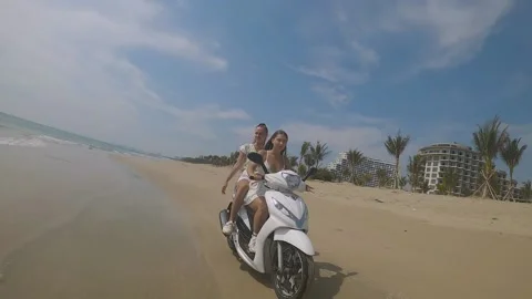 Fpv camera flies after two girls on a motorcycle Stock Footage 237731335