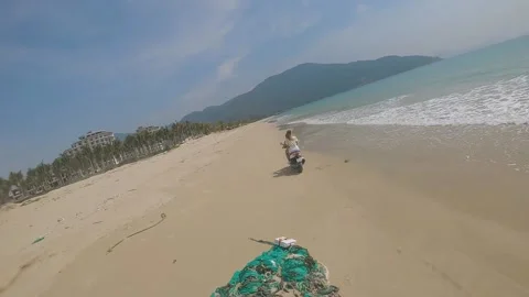 Fpv camera flies after two girls on a motorcycle Video stock 237731351